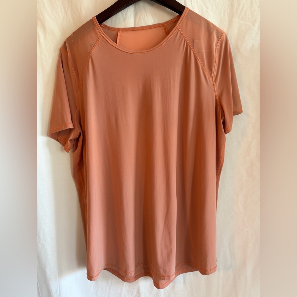 Lululemon Sculpt Top in salmon pink.